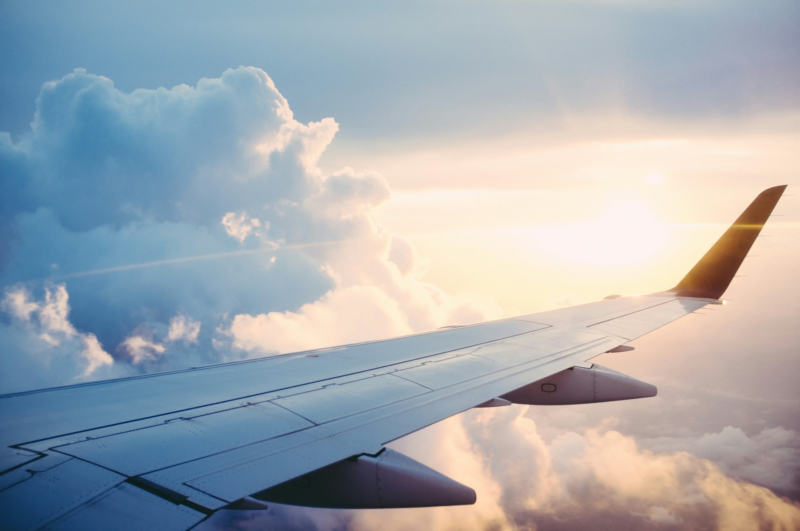 View out of an airplane window of the wing
